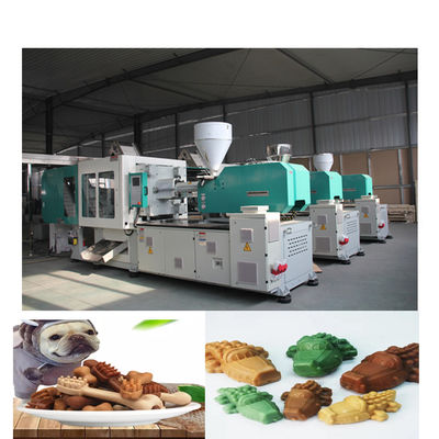 Любимец зубоврачебной заботы отлитый в форму жуя собачью еду делая машину для любимца обрабатывает